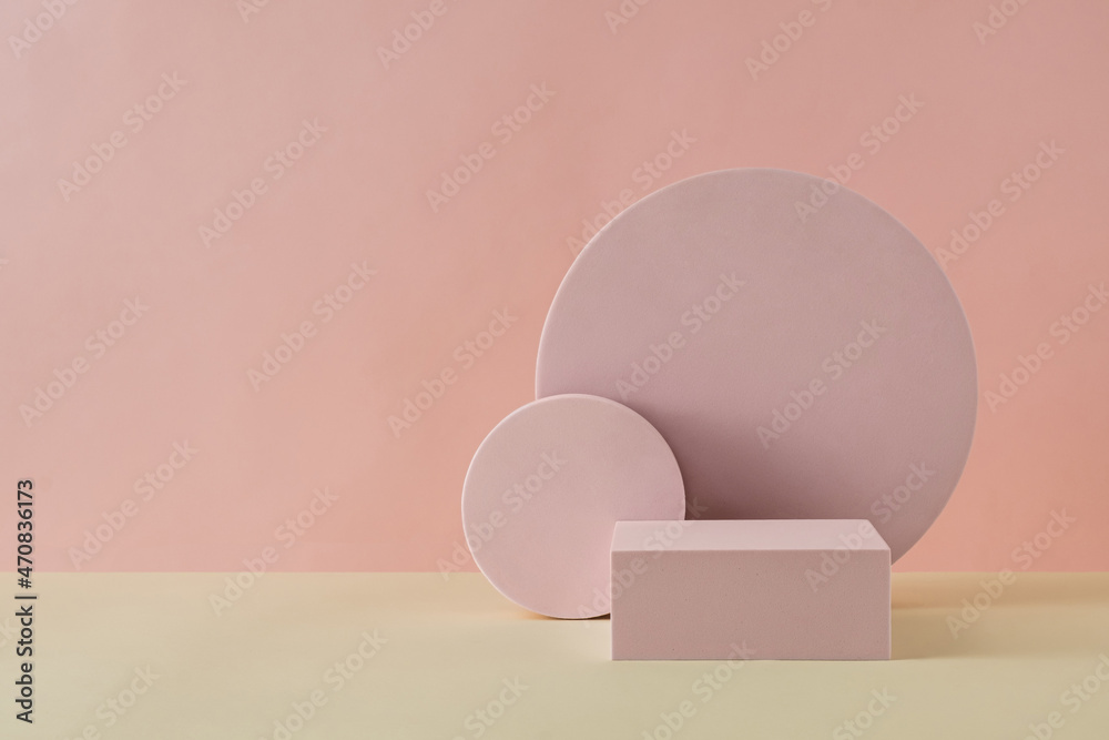 Round and rectangular shapes against pink wall Round and rectangular shapes against pink wall