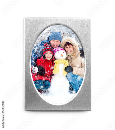 Silver oval frame with happy family photo isolated on white background photo