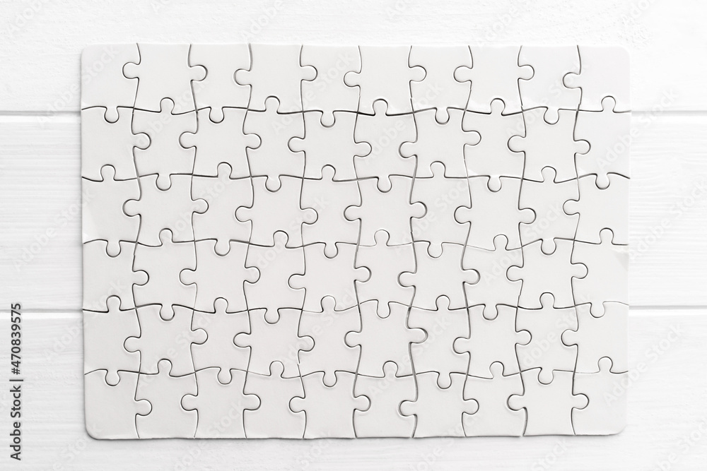 Top view of white jigsaw puzzle Top view of white jigsaw puzzle
