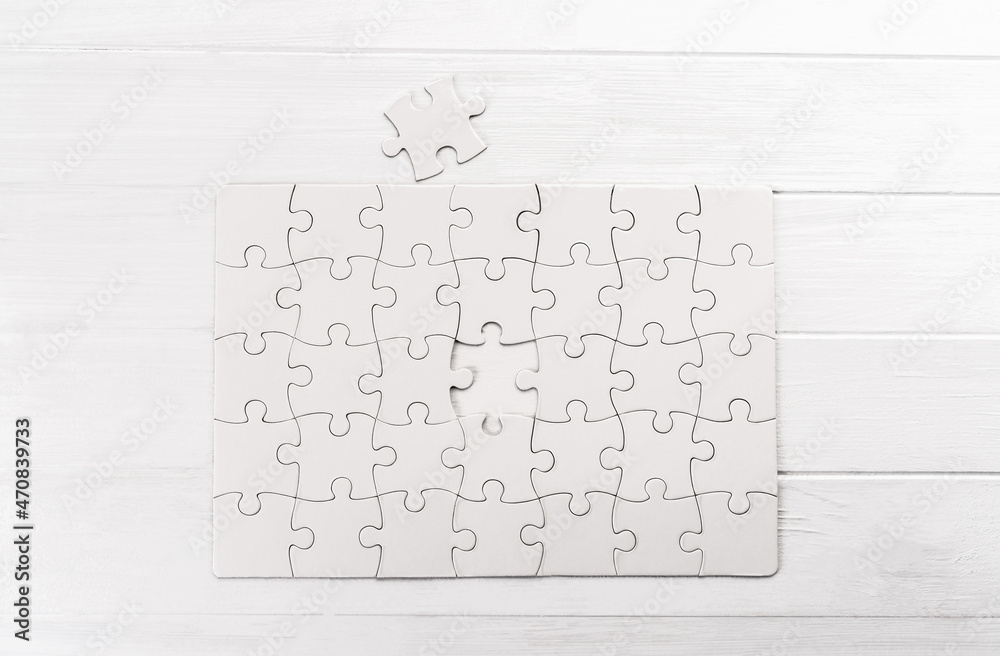 Top view of white jigsaw puzzle Top view of white jigsaw puzzle