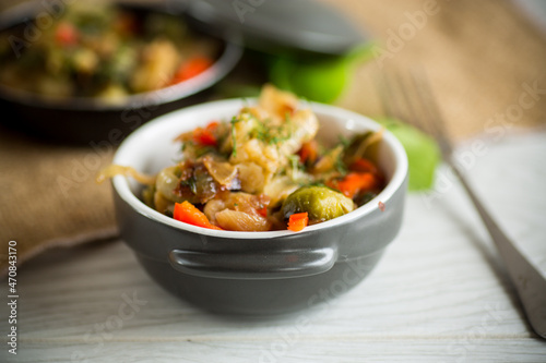 fried brussels sprouts with cauliflower and other vegetables in a bowl