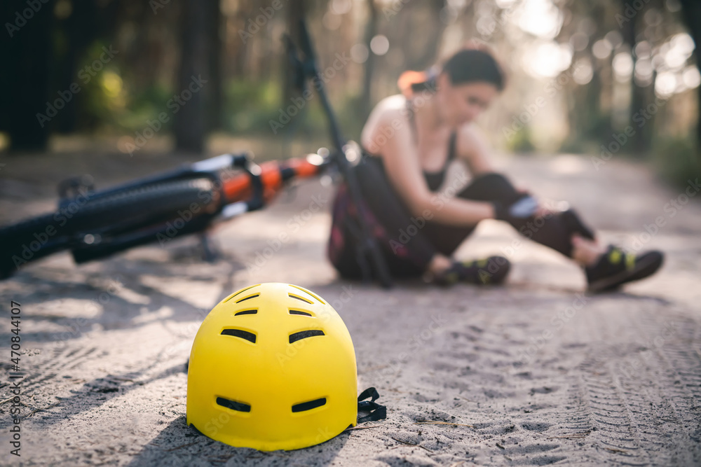 Protective helmet on forest road, bike accident Stock Photo | Adobe Stock