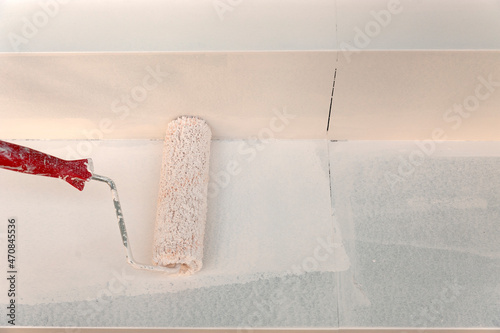 Worker painting wall. Wall painting.Stock photo.