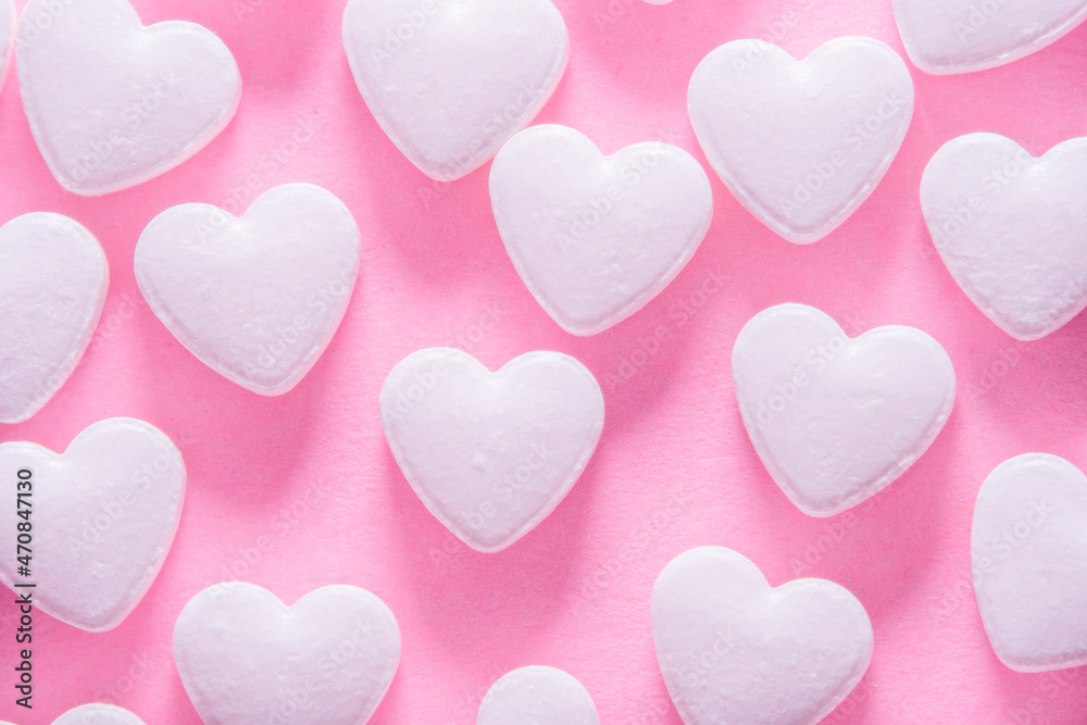 Heart shaped pills on a pink background. Medicines for the heart and for blood vessels and lungs.