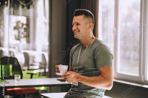 Office worker having coffee while coffee break photo