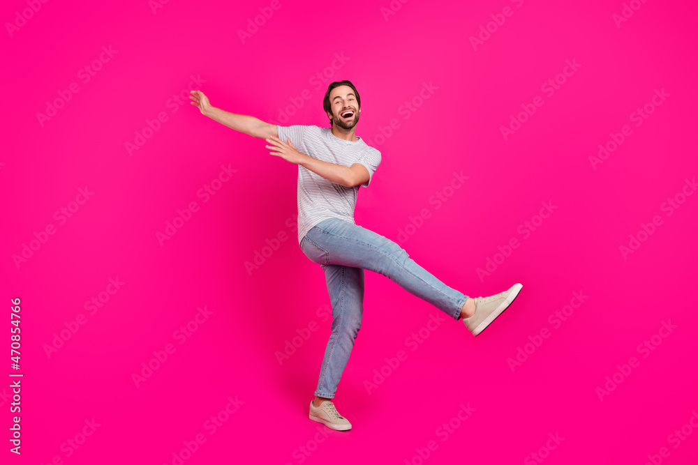 Full size profile side photo of young guy good mood fooling dance isolated over magenta color background