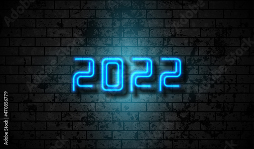 Neon New Year 2022 on grunge brick wall abstract background. Vector greeting card design