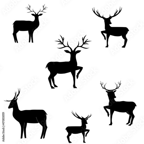 Set of black silhouettes of deer on white