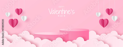 Paper cut of Valentine's Day background with pink cylinder podium, origami white and pink heart and clouds for products display presentation, poster, greeting card, headers website