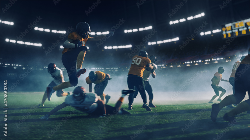 American Football Stadium Two Teams Compete: Successful Player Jumping Over Defense Running to Score Touchdown Points. Professional Athletes Compete for Ball, Tackle, Fight for Championship Victory