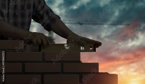 Silhouette construction mason worker bricklayer  construction laying bricks