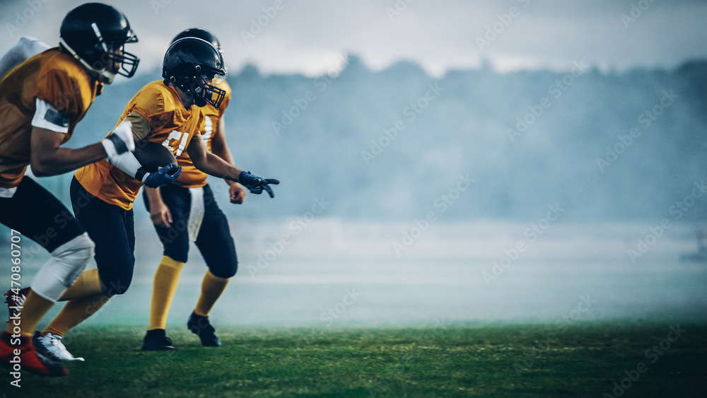 Fototapeta premium American Football Field Two Teams Compete: Players Pass and Run Attacking to Score Touchdown Points. Professional Athletes Compete for the Ball, Tackle, Fight for Victory.