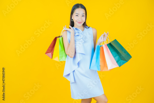 Portrait beautiful young asian woman smile with shopping bag