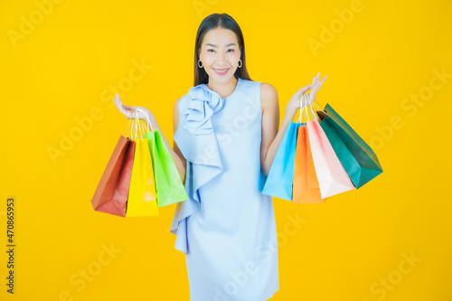 Portrait beautiful young asian woman smile with shopping bag