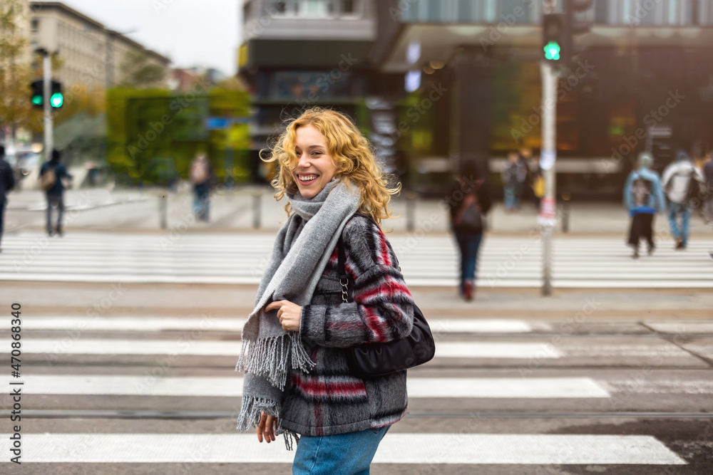 Young woman on a crosswalk in Warsaw, Poland
Young woman on a crosswalk in Warsaw, Poland