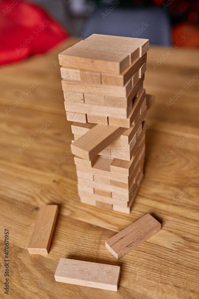 Tower of wood blocks stack game on the table, family game, business education, risk, development, and growth concept, copy space.