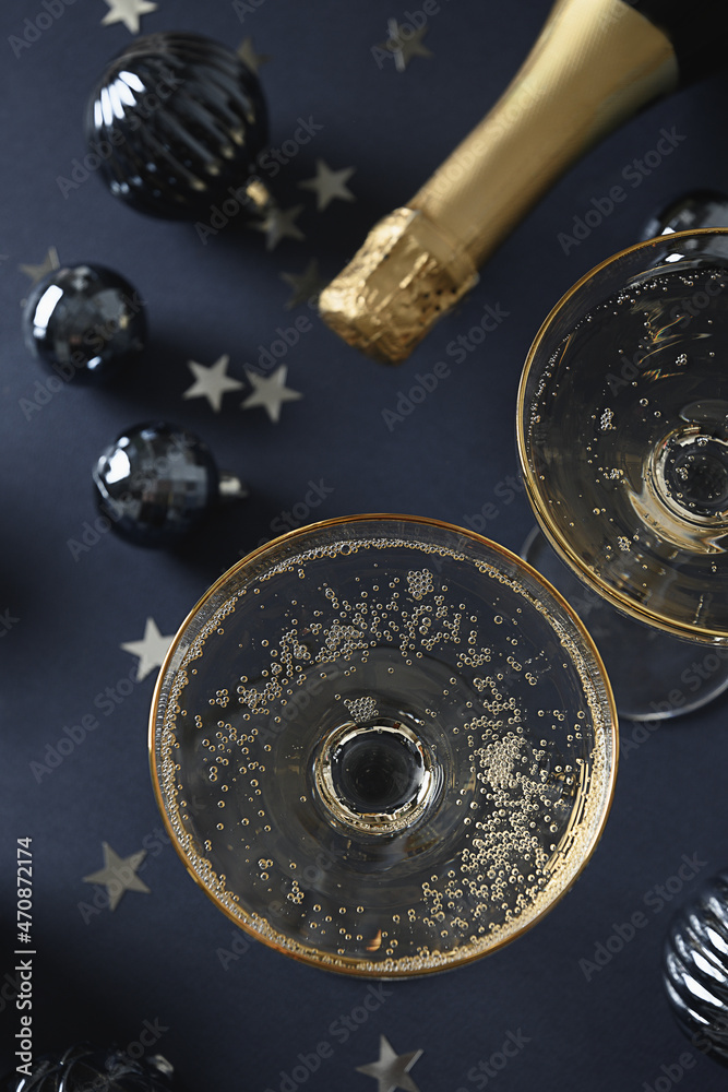 Festive New Year champagne fro Festivity on navy blue background. Close up.