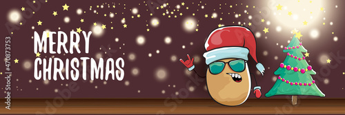 vector funky cartoon smiling santa claus potato with red santa hat and calligraphic christmas text on horizontal night background with blur and lights. vegetable funky christmas food character