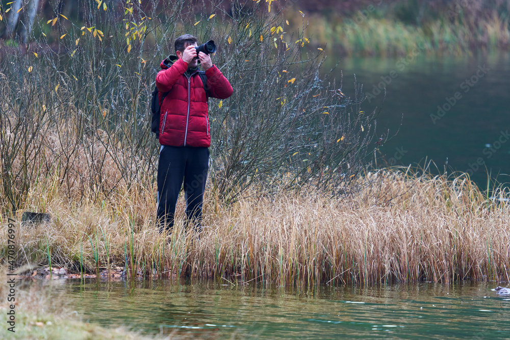 Nature photographer by the lake Nature photographer by the lake