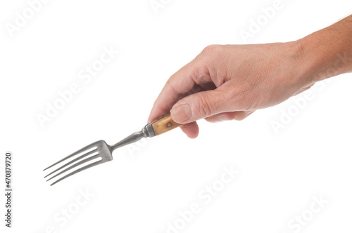 Man hand holding old fashioned fork isolated on white background