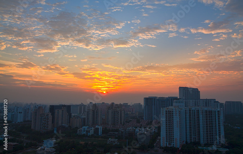 Colorful sunset,sky, mackerel clouds in Delhi NCR city Gurugram,Haryana,India.View of city's residential apartments,commercial hub during monsoon on July 24,2021.