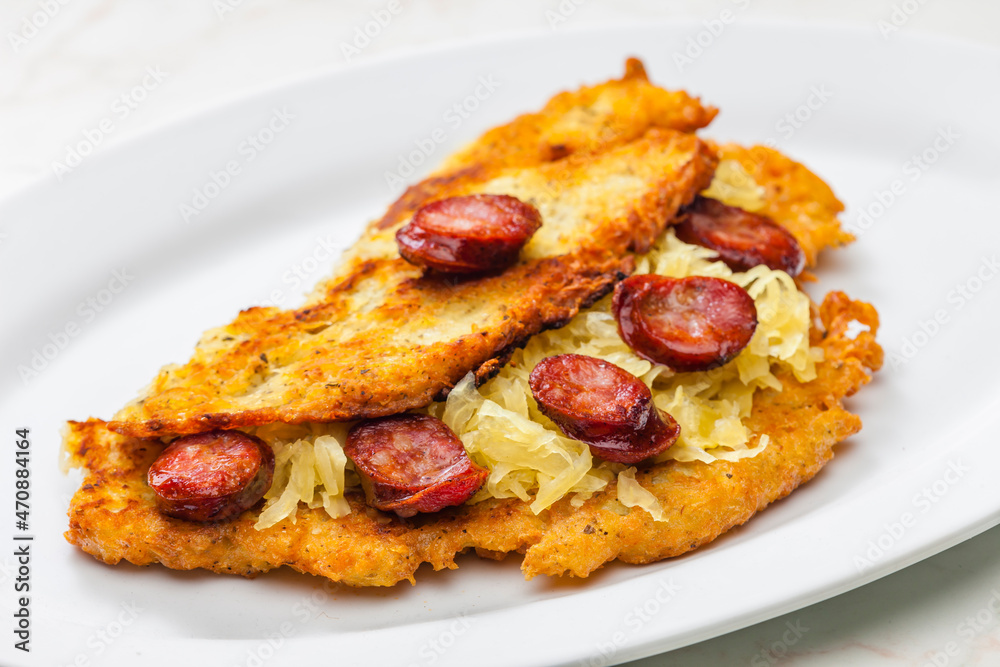 potato pancake filled with cabbage and sausage potato pancake filled with cabbage and sausage