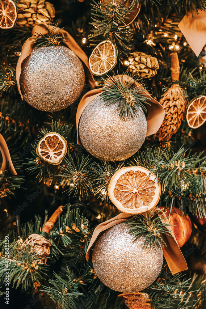 Dried orange slices and shiny silver balls on Christmas tree, pine ...