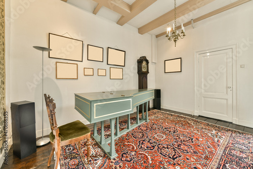 Vintage harpsichord on carpet in room photo