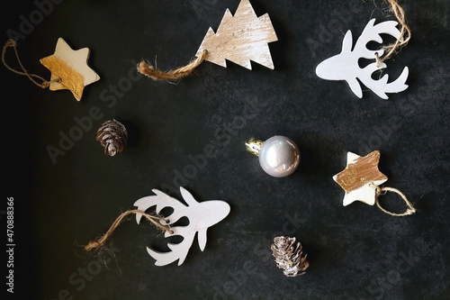 Various Christmas ornaments on dark background. Flat lay.