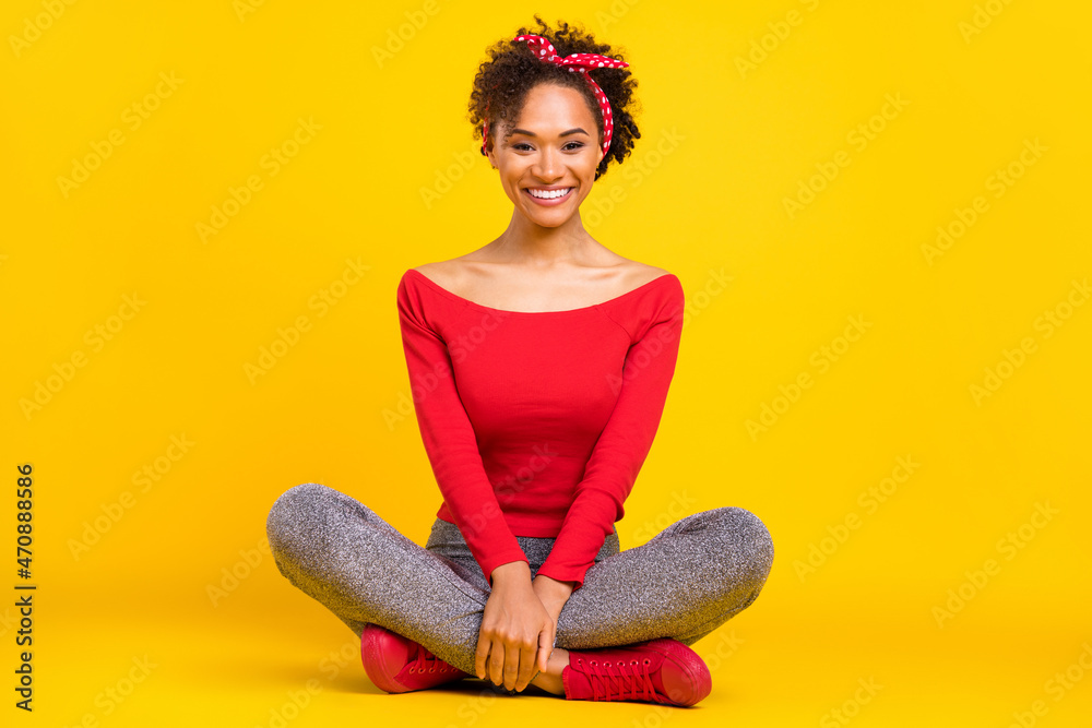 Photo of cheerful lovely pretty lady relax sit floor wear pin-up outfit shiny pants isolated yellow color background Photo of cheerful lovely pretty lady relax sit floor wear pin-up outfit shiny pants isolated yellow color background