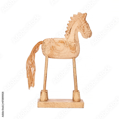 A wooden carved folkloric horse on a white background packshoot