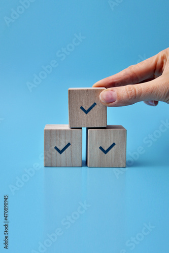 Wallpaper Mural Wooden blocks with drawings of checkmarks. A symbol of consent and correct choice Torontodigital.ca