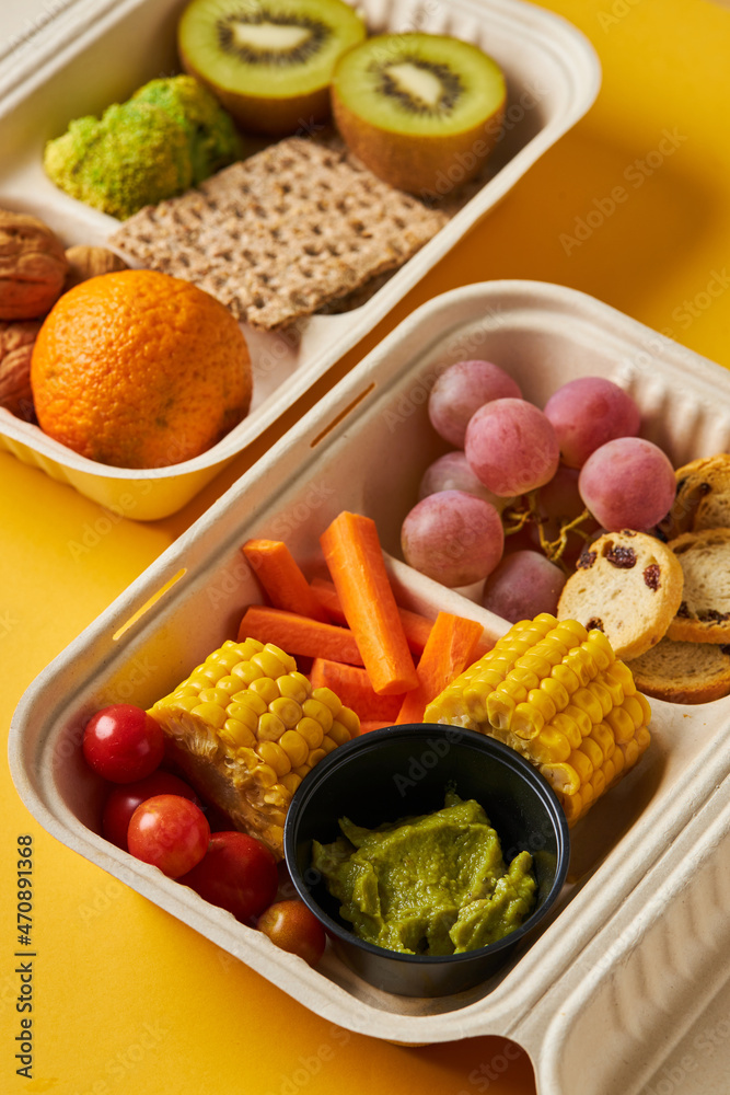 Opened containers with healthy snacks on table Opened containers with healthy snacks on table