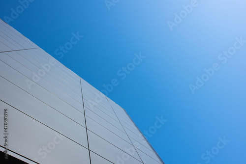 Gray modern board building wall against the sky