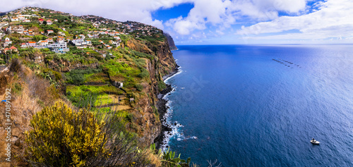 Madeira island scenery, view of small villages over steppy rocky mountains. Portugal