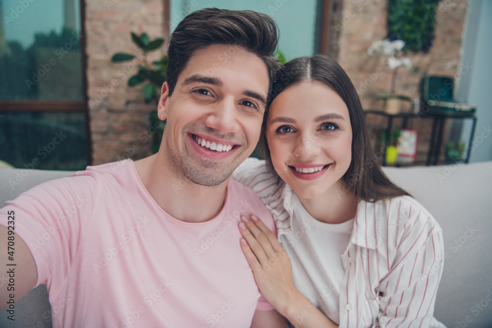 Self-portrait of attractive cheerful married spouses enjoying spending time daydream hugging pastime at home indoors Self-portrait of attractive cheerful married spouses enjoying spending time daydream hugging pastime at home indoors