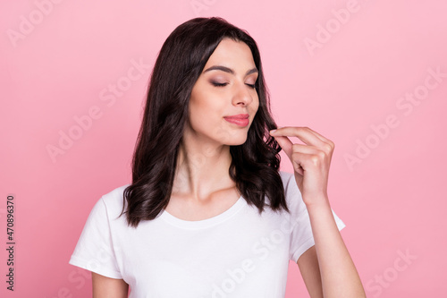 Photo of charming young happy calm woman make fingers chef sign tasty isolated on pink color background