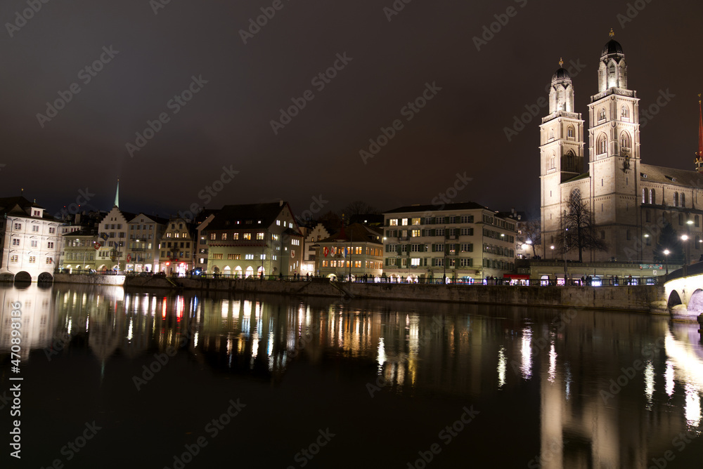 Old town of Zürich at autumn night with river Limmat and protestant church Great Minster. Photo taken November 20th, 2021, Zurich, Switzerland.