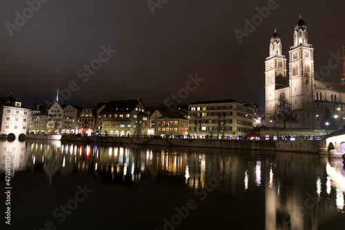 Old town of Z  rich at autumn night with river Limmat and protestant church Great Minster. Photo taken November 20th  2021  Zurich  Switzerland.