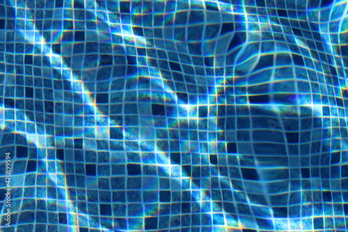 Swimming pool blue tiles through water