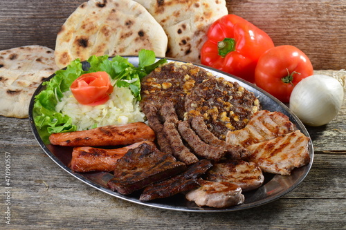 Mixed Balkan grill on a plate photo