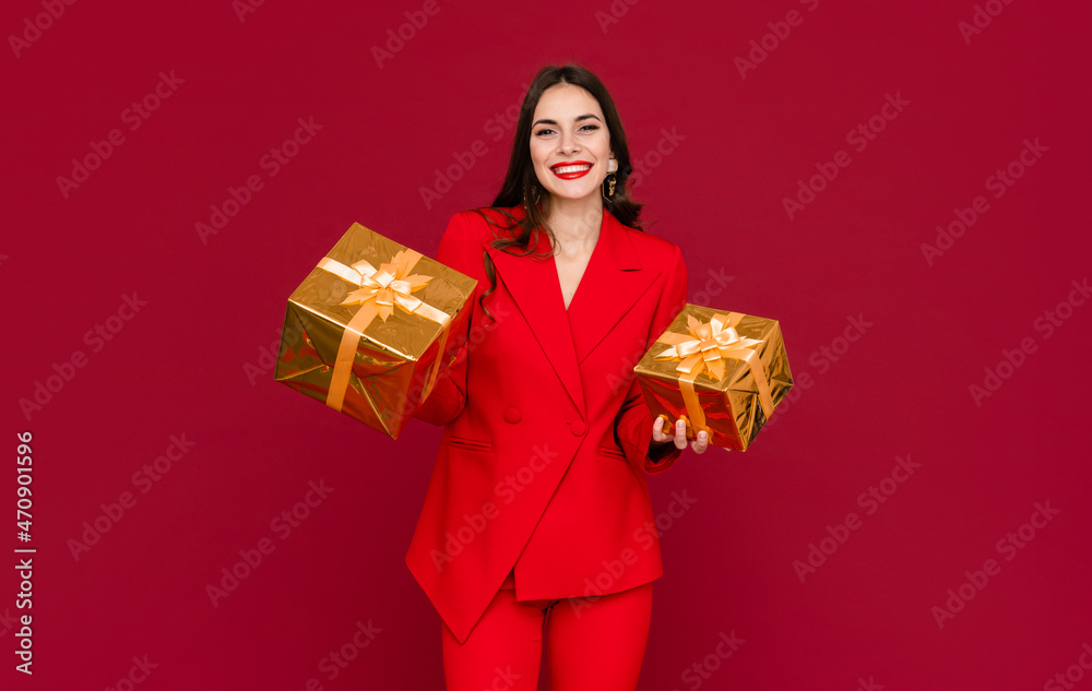 attractive woman celebrating Christmas on red background attractive woman celebrating Christmas on red background