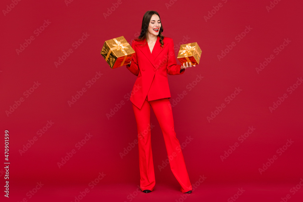 attractive woman celebrating Christmas on red background attractive woman celebrating Christmas on red background