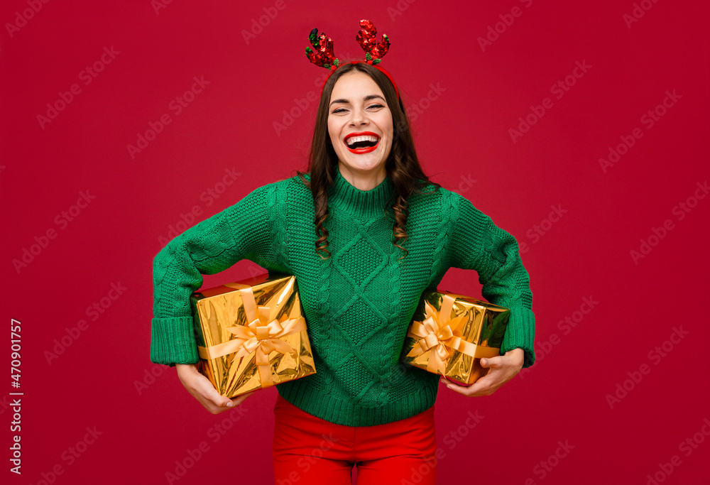 attractive woman celebrating Christmas on red background attractive woman celebrating Christmas on red background