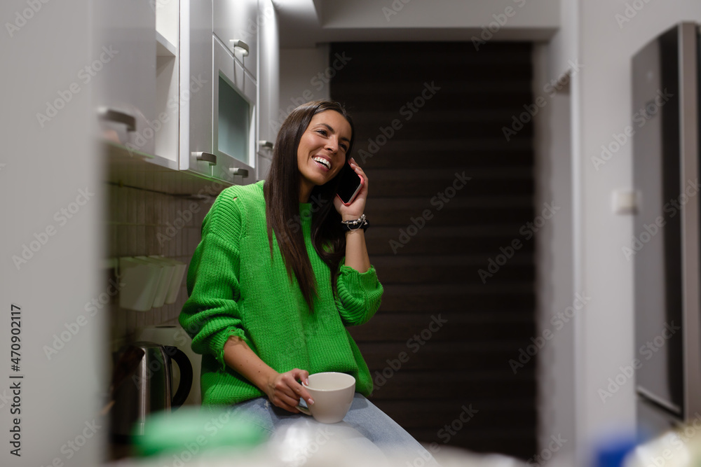 Happy woman dressed casually chats with friend over smart phone. Happy woman dressed casually chats with friend over smart phone.