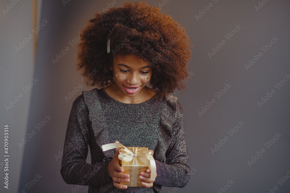 Lovely festive girl with a gift box Lovely festive girl with a gift box