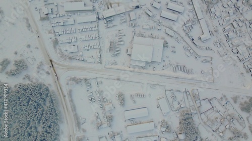 An aerian view of a town under the snow