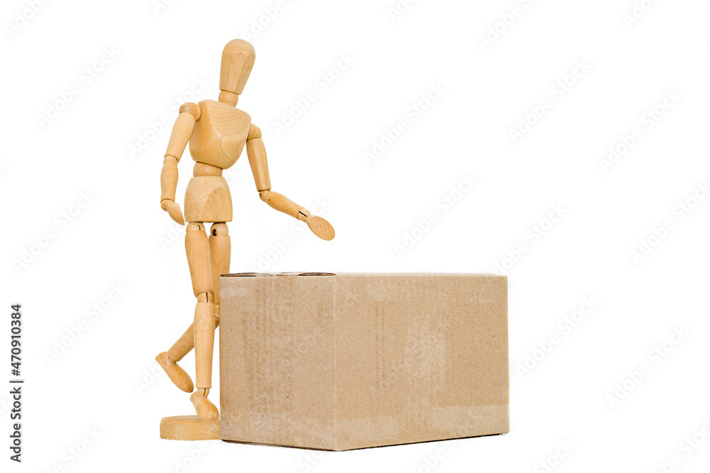 wooden man next to a cardboard box isolates wooden man next to a cardboard box isolates