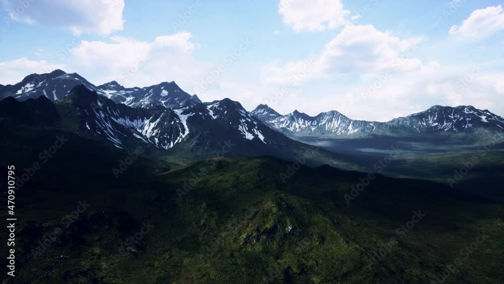 sunny landscape with views of snow-capped mountains and meadow sunny landscape with views of snow-capped mountains and meadow
