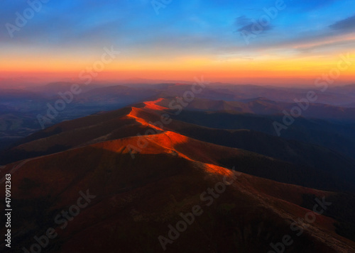 Aerial view on Carpathians mountains peak at sunset